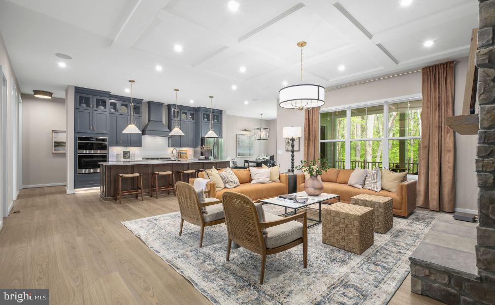 0 Hampstead Farm Stafford, VA 22556 - Photo 3 of 23 a living room with stainless steel appliances kitchen island granite countertop furniture and a wooden floor