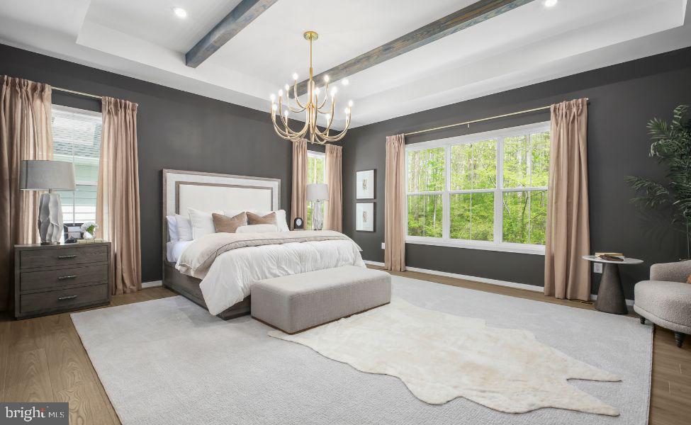 0 Hampstead Farm Stafford, VA 22556 - Photo 5 of 23 a spacious bedroom with a large bed and a chandelier