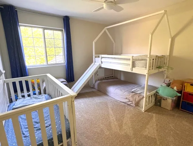 a bedroom with a bed and a tv