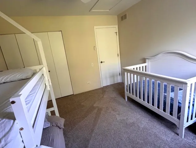 a bedroom with furniture and window