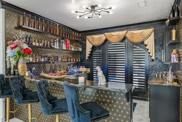 a living room with furniture and dining table