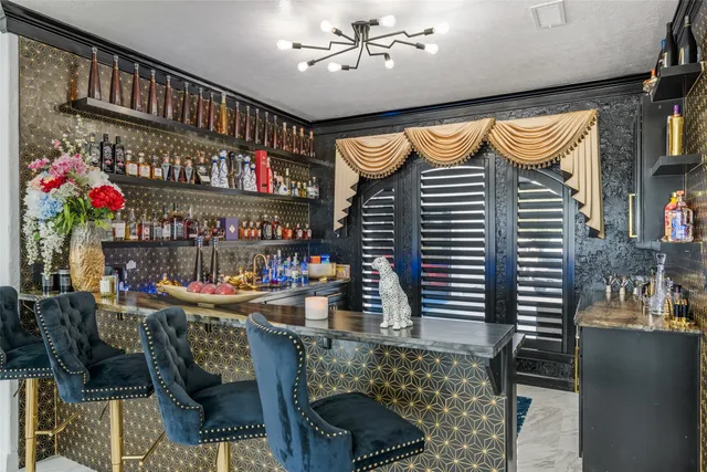 a living room with furniture and dining table