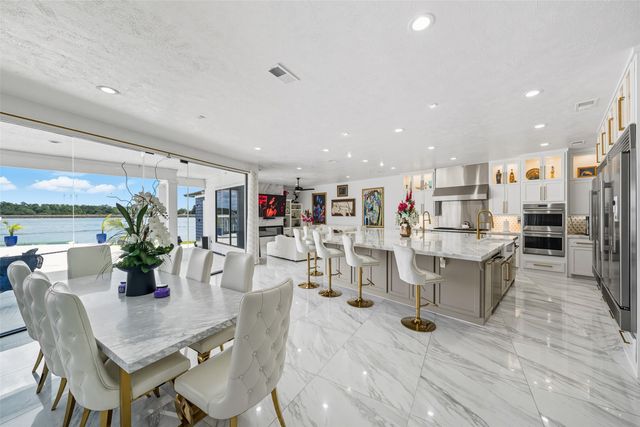 a kitchen area with stainless steel appliances and a counter space