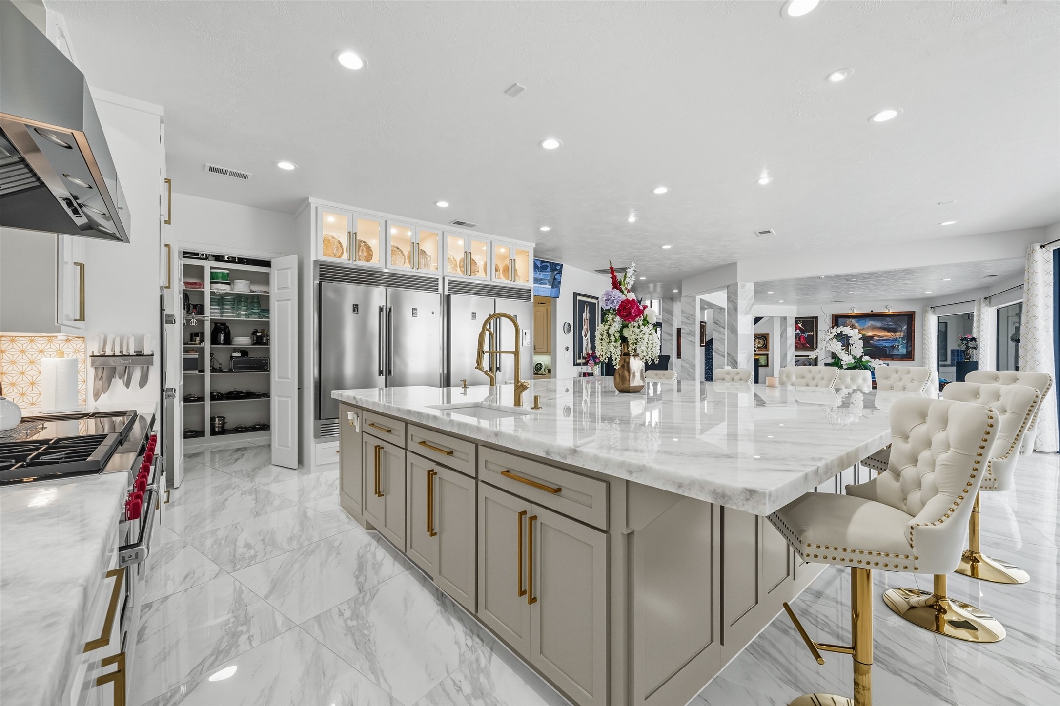 2500 Sand Shore Drive Conroe, TX 77304 - Photo 20 of 50 a kitchen with stainless steel appliances kitchen island granite countertop a table and chairs in it