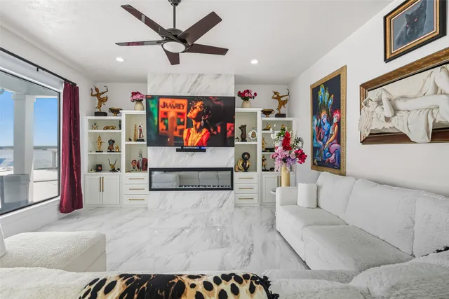 a living room with furniture and a flat screen tv