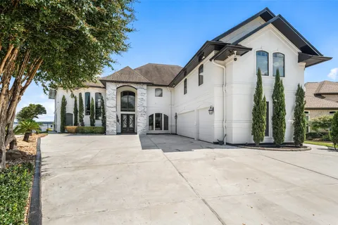 a view of a white house with a outdoor space