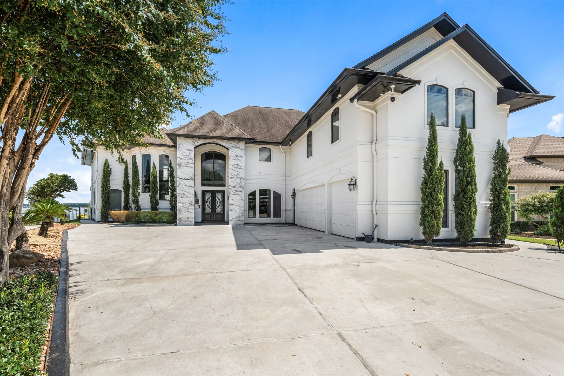 2500 Sand Shore Drive Conroe, TX 77304 - Photo 3 of 50 a view of a white house with a outdoor space