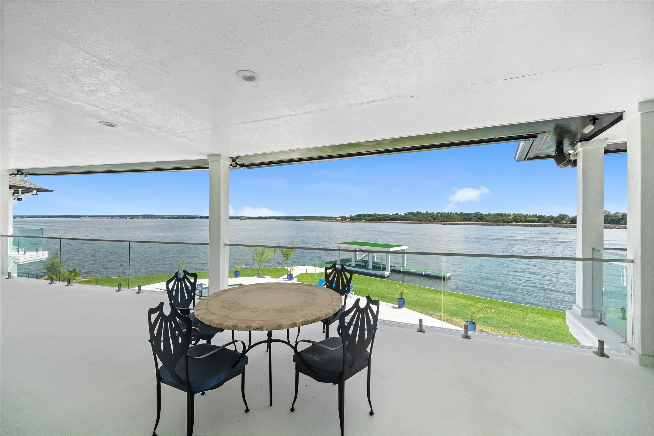 2500 Sand Shore Drive Conroe, TX 77304 - Photo 31 of 50 a view of a chairs and table in the patio