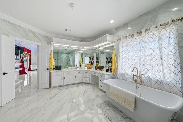 a bathroom with a double vanity sink mirror and shower