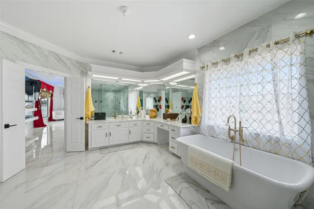 a bathroom with a double vanity sink mirror and shower