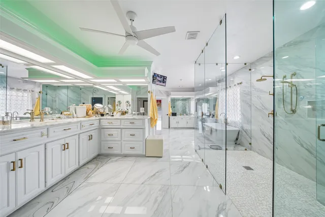 a large white tub sitting in a bathroom