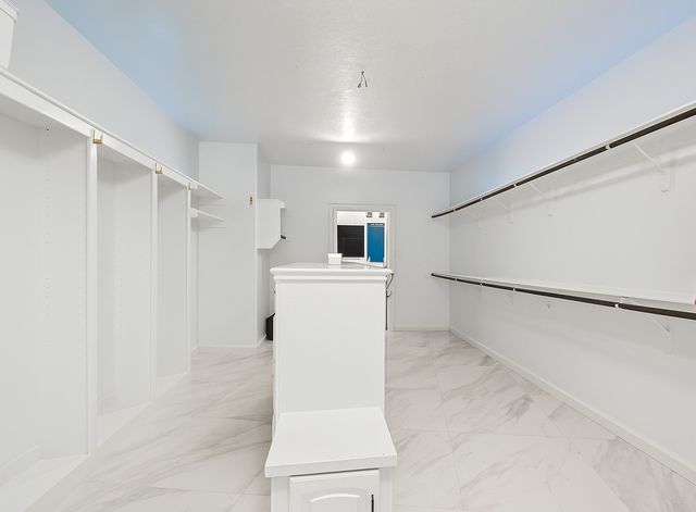 a large bathroom with a double vanity sink mirror and shower