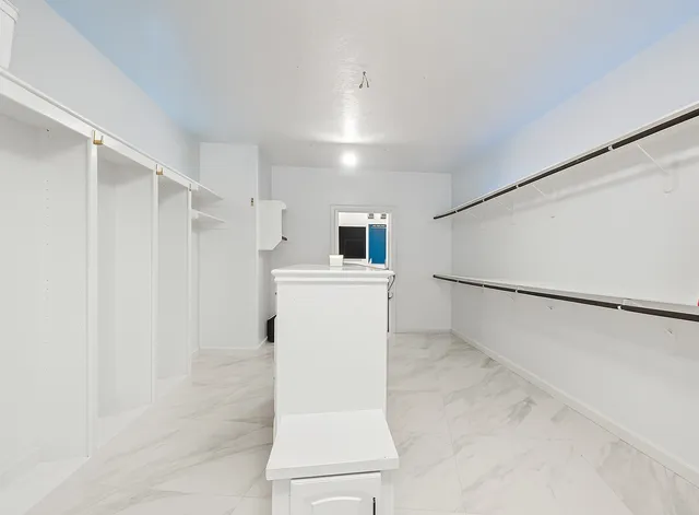 a large bathroom with a double vanity sink mirror and shower