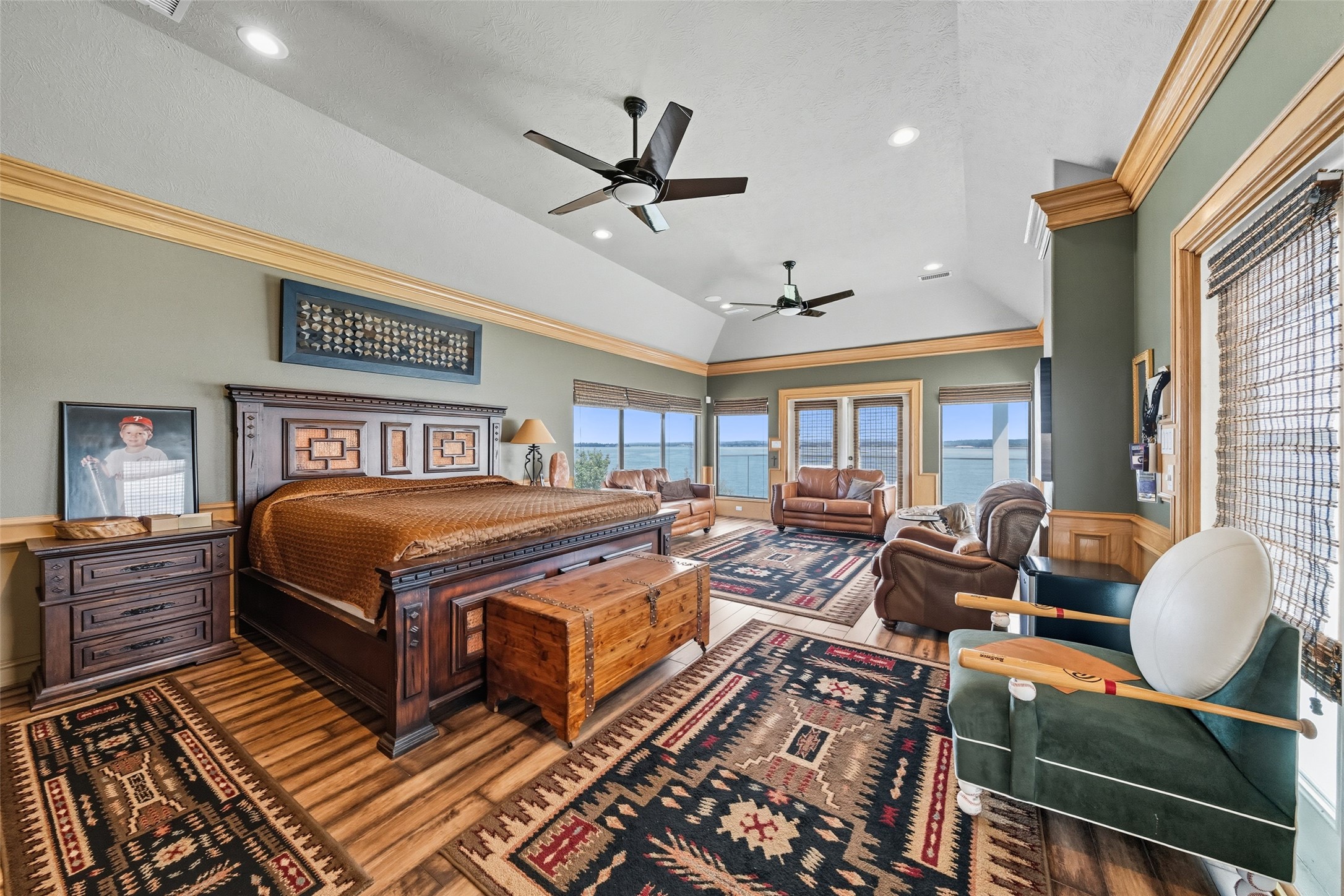 2500 Sand Shore Drive Conroe, TX 77304 - Photo 37 of 50 a bedroom with a bed and wooden floor