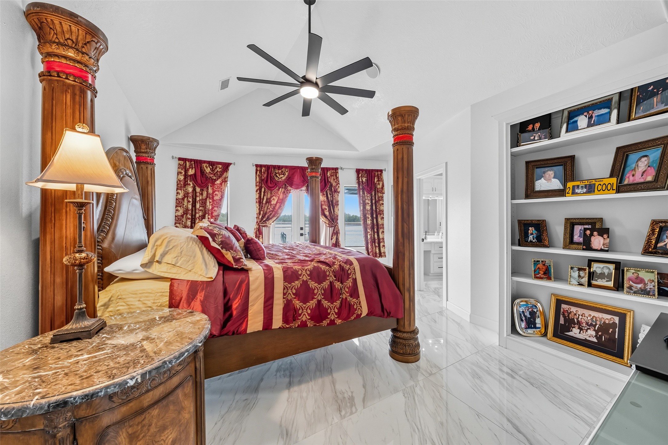 2500 Sand Shore Drive Conroe, TX 77304 - Photo 40 of 50 a bedroom with a bed and a book shelf