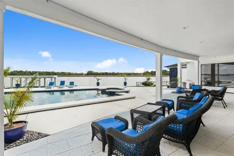 a kitchen with stainless steel appliances granite countertop a sink and a stove