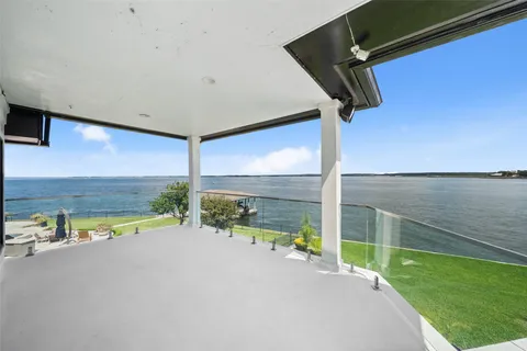 a view of swimming pool with an outdoor seating