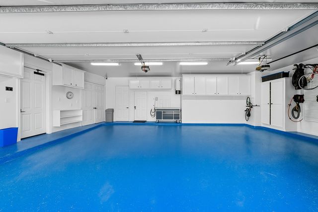 an aerial view of a house with a lake view