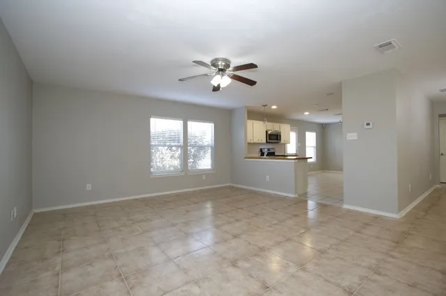 a view of a kitchen with a sink and a window