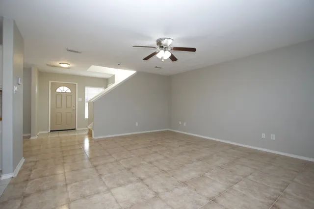 a kitchen with stainless steel appliances kitchen island granite countertop a sink a stove top oven a counter space and cabinets