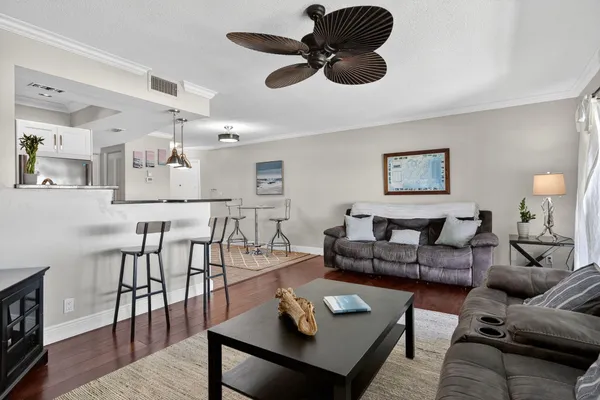 a kitchen with stainless steel appliances kitchen island a refrigerator and a stove top oven