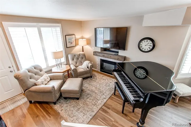 a bedroom with a large bed and a flat tv screen on dresser