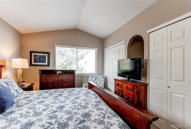 a bathroom with a sink a toilet and shower curtain