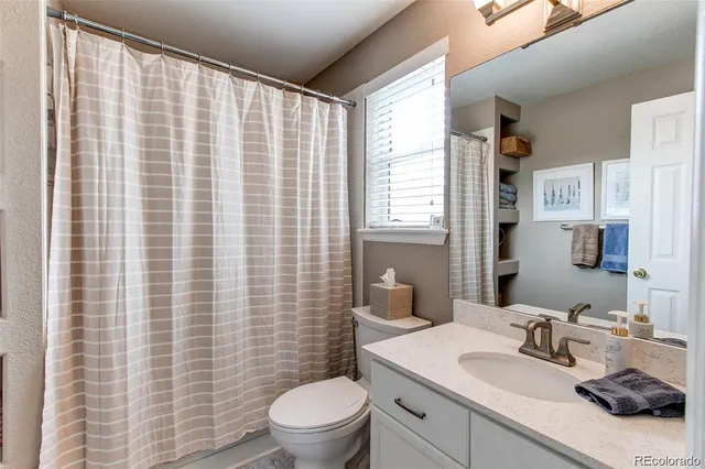 a bedroom with bed and window