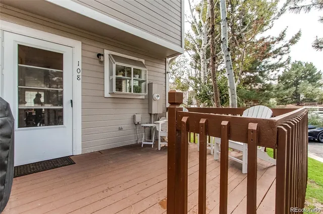 a view of a house with a wooden fence