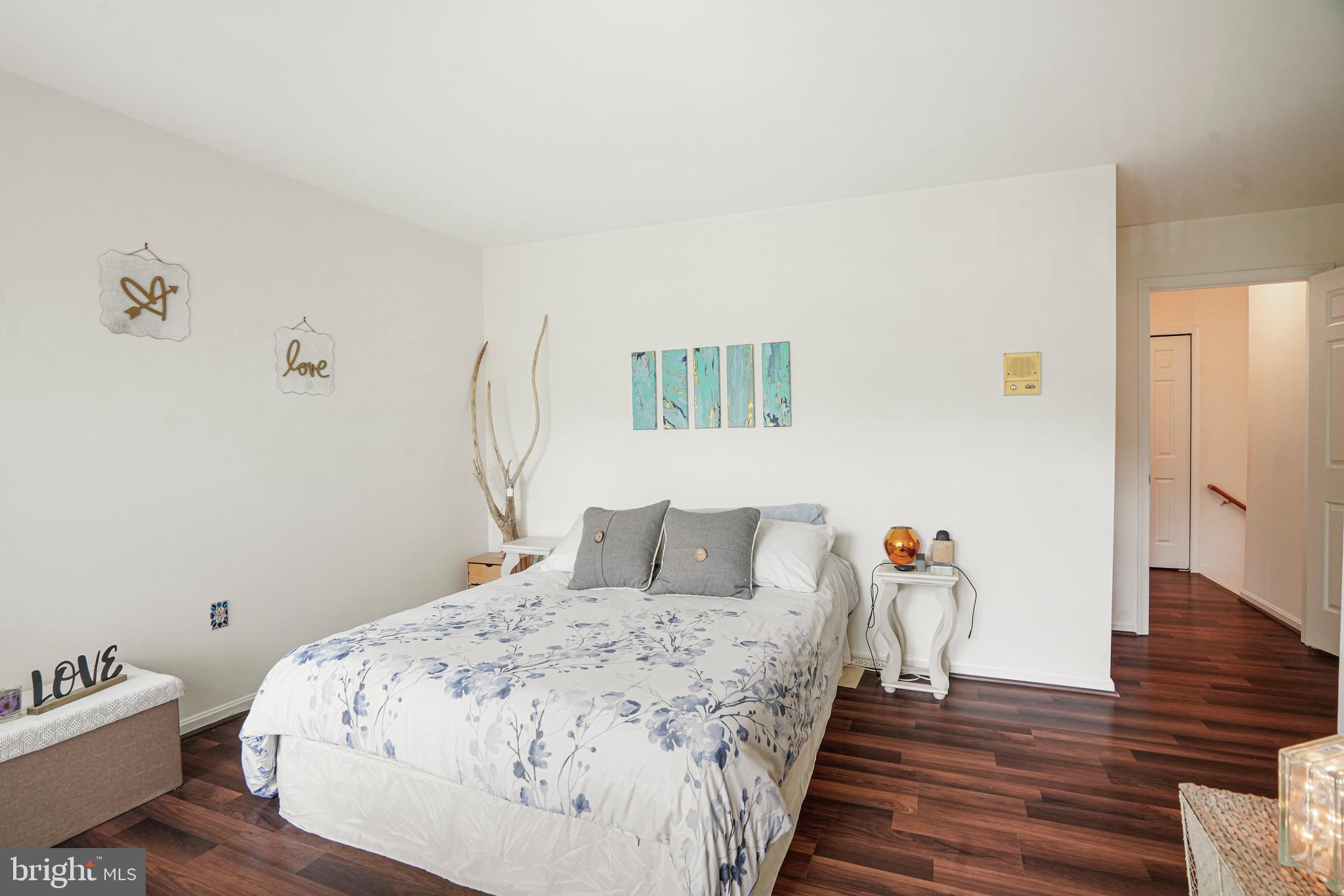 8872 Woodland Drive Silver Spring, MD 20910 - Photo 17 of 47 a bedroom with a bed and wooden floor