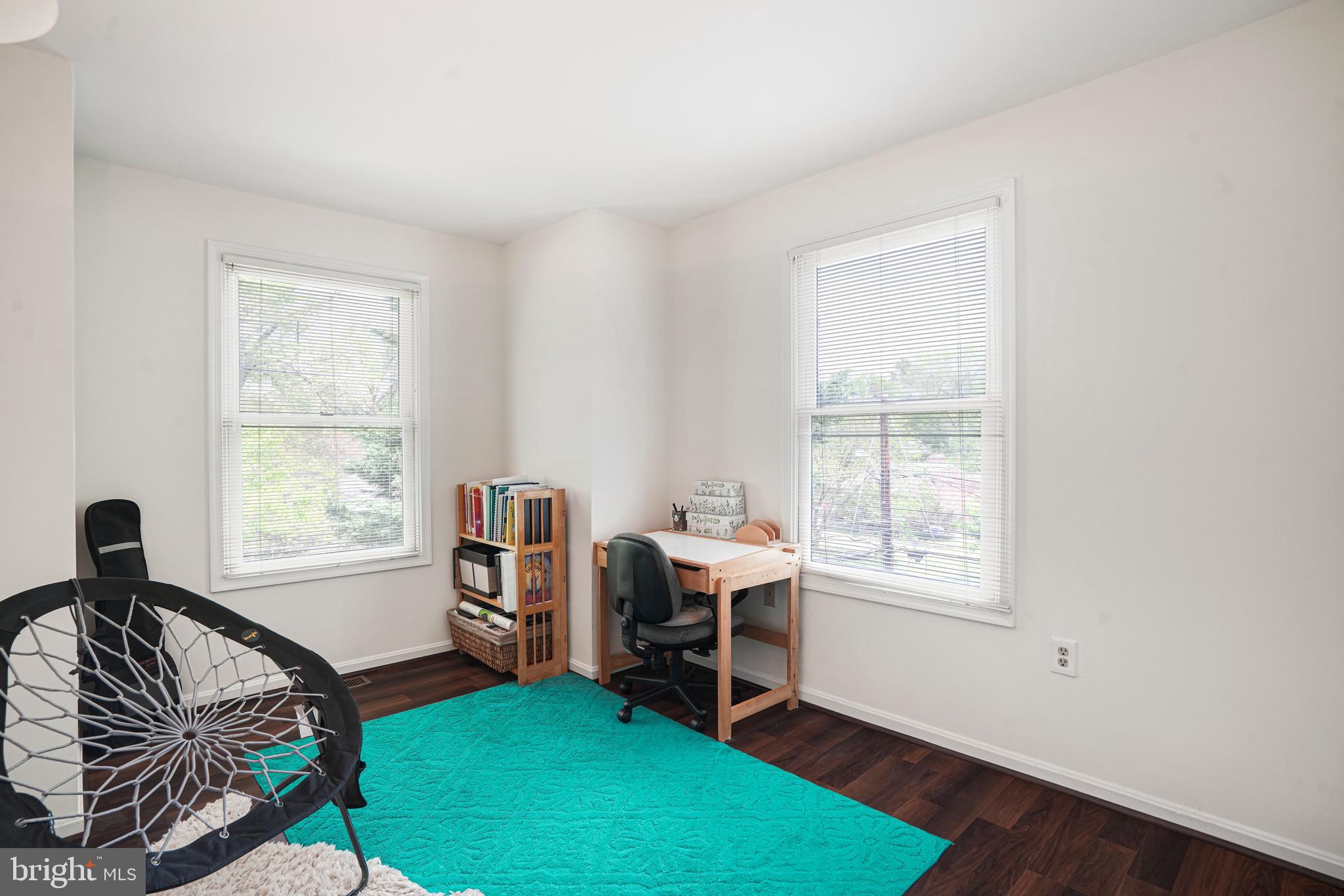 8872 Woodland Drive Silver Spring, MD 20910 - Photo 22 of 47 a view of a livingroom with workspace and a window