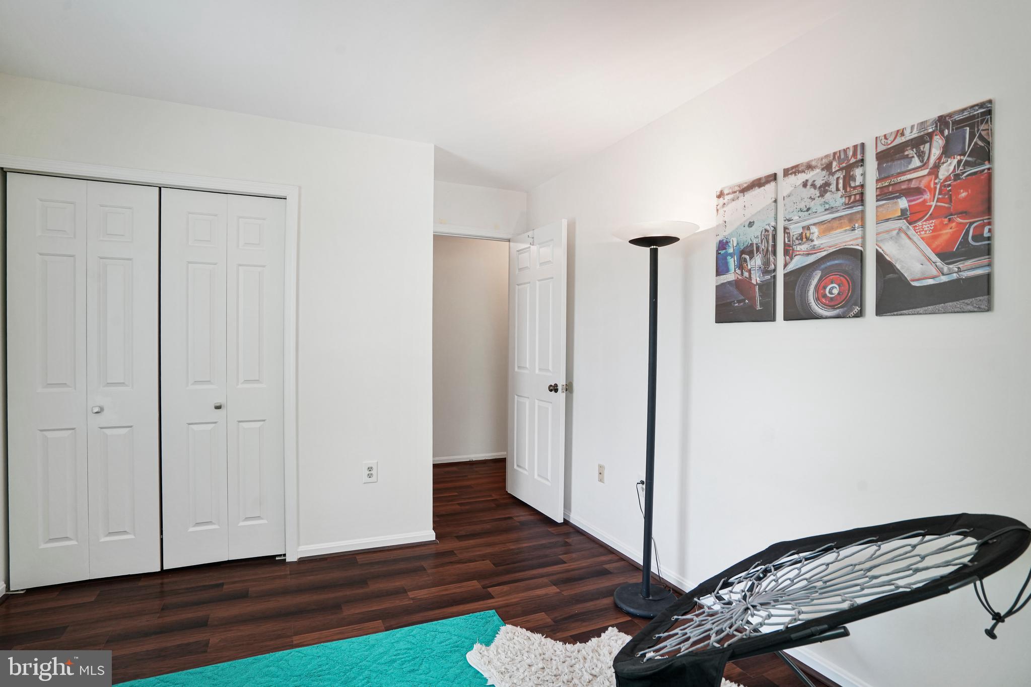 8872 Woodland Drive Silver Spring, MD 20910 - Photo 23 of 47 a view of a room with wooden floor and closet