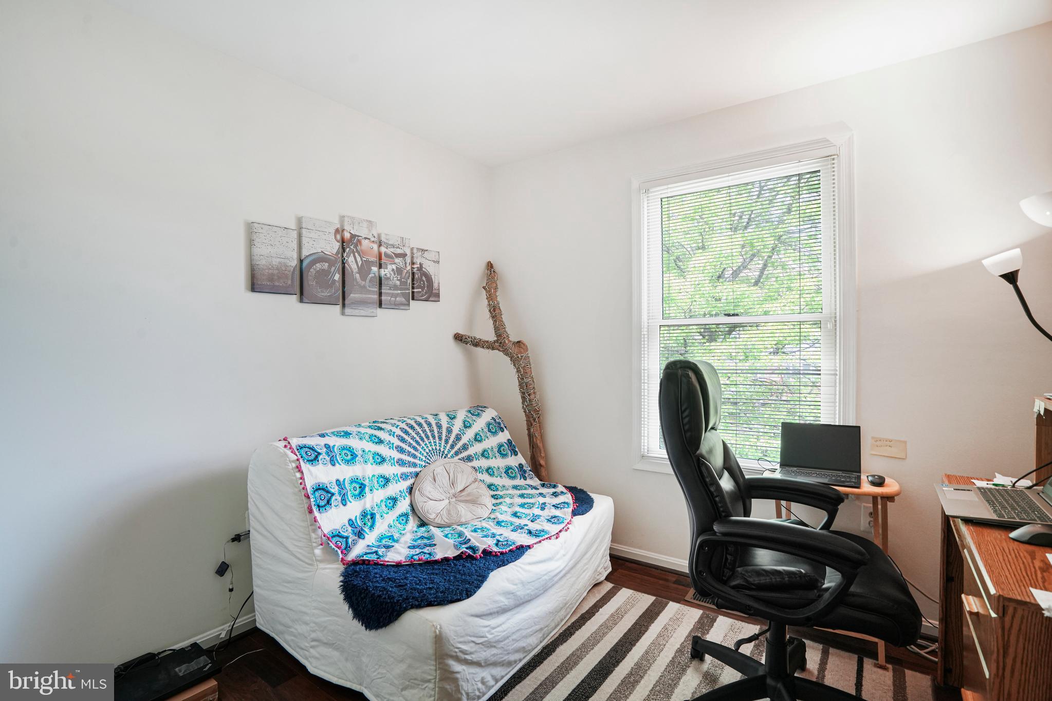 8872 Woodland Drive Silver Spring, MD 20910 - Photo 24 of 47 a living room with furniture and a potted plant