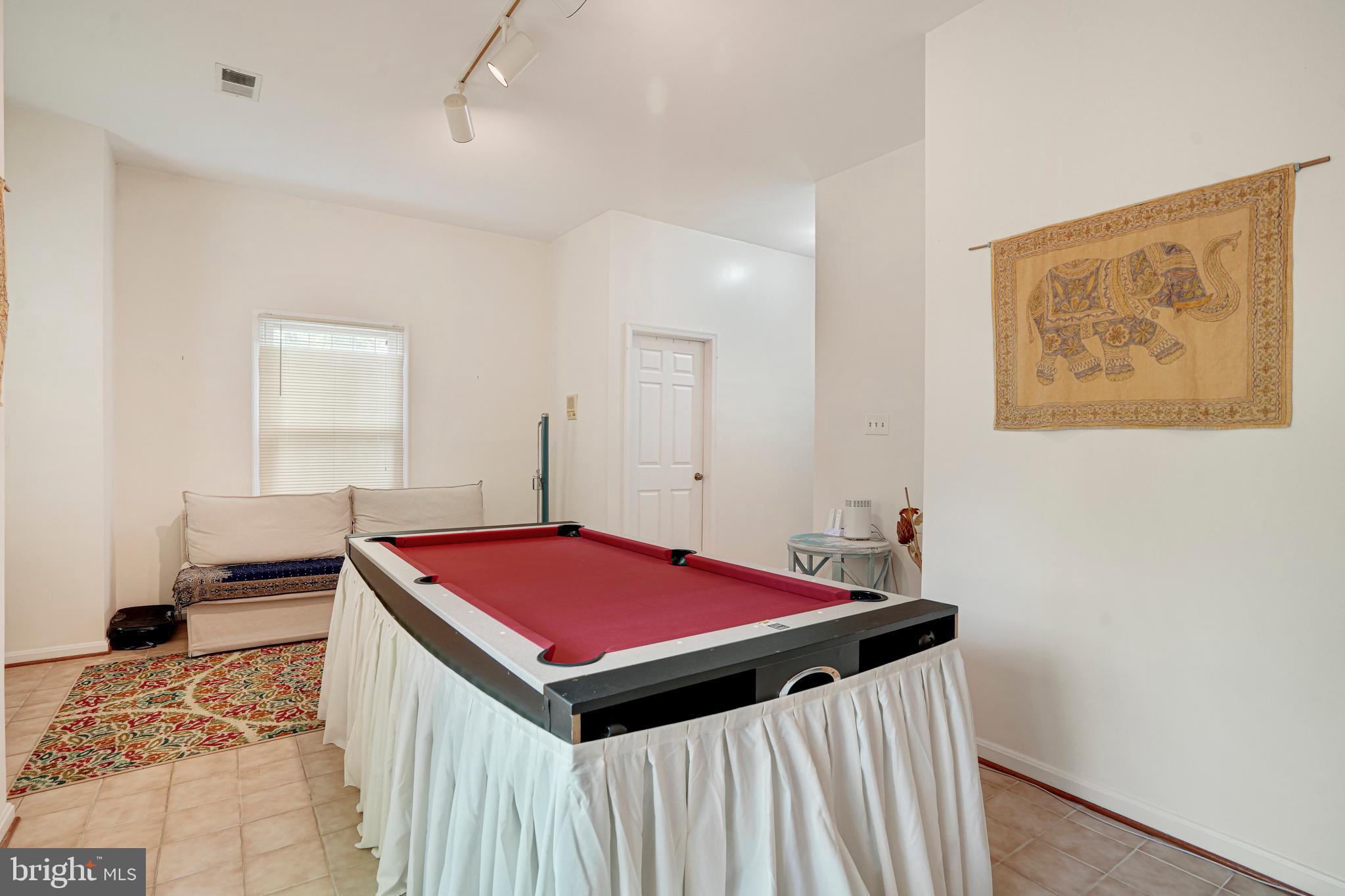 8872 Woodland Drive Silver Spring, MD 20910 - Photo 29 of 47 a room with pool table and windows