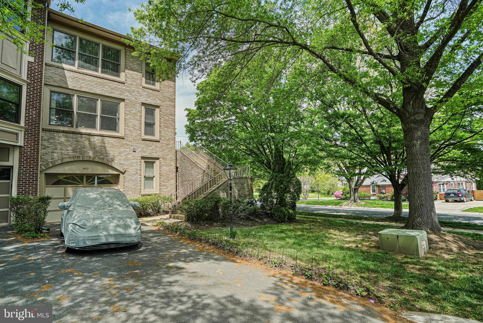 8872 Woodland Drive Silver Spring, MD 20910 - Photo 3 of 47 a front view of a house with a garden