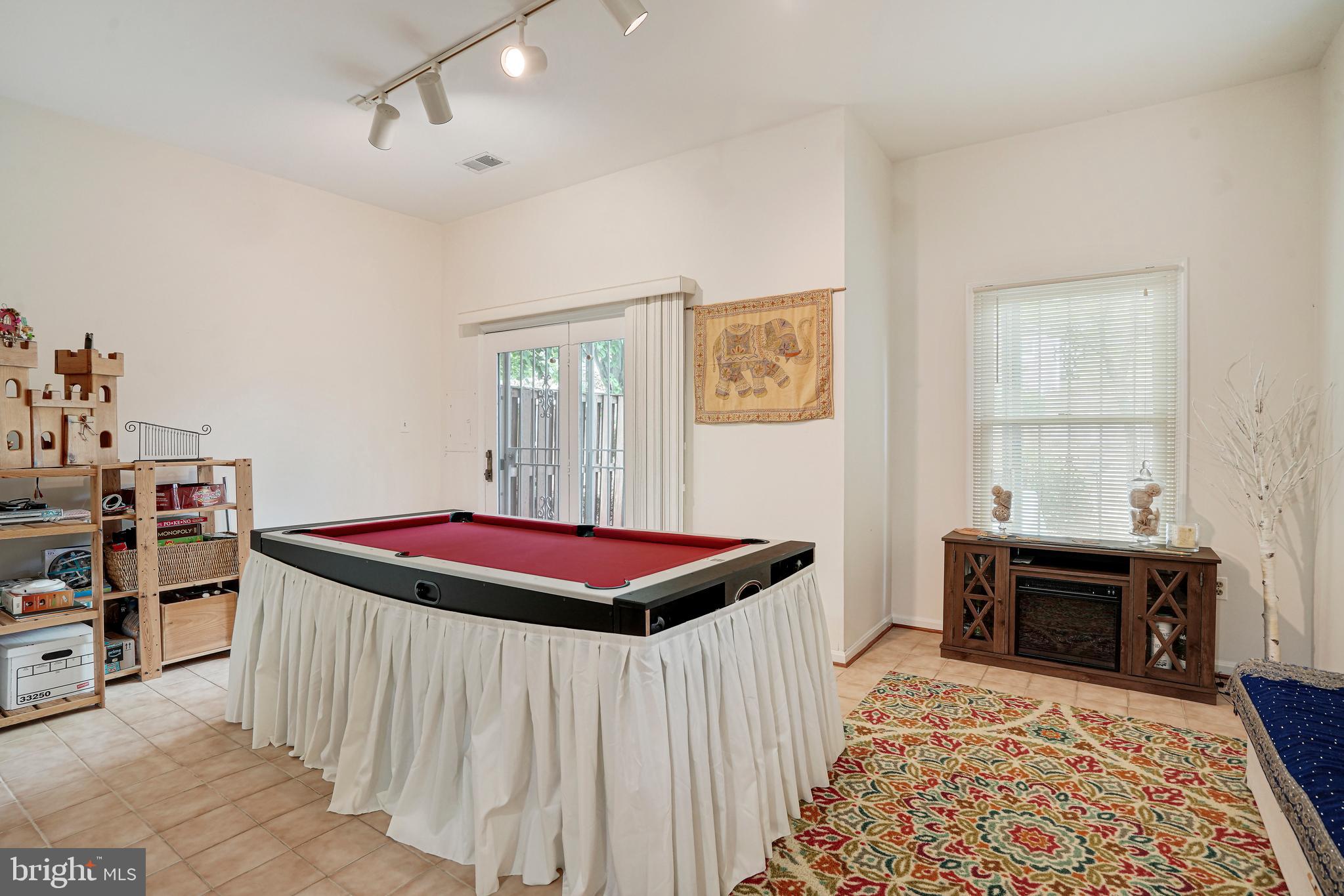 8872 Woodland Drive Silver Spring, MD 20910 - Photo 30 of 47 a bedroom with a bed and a fireplace