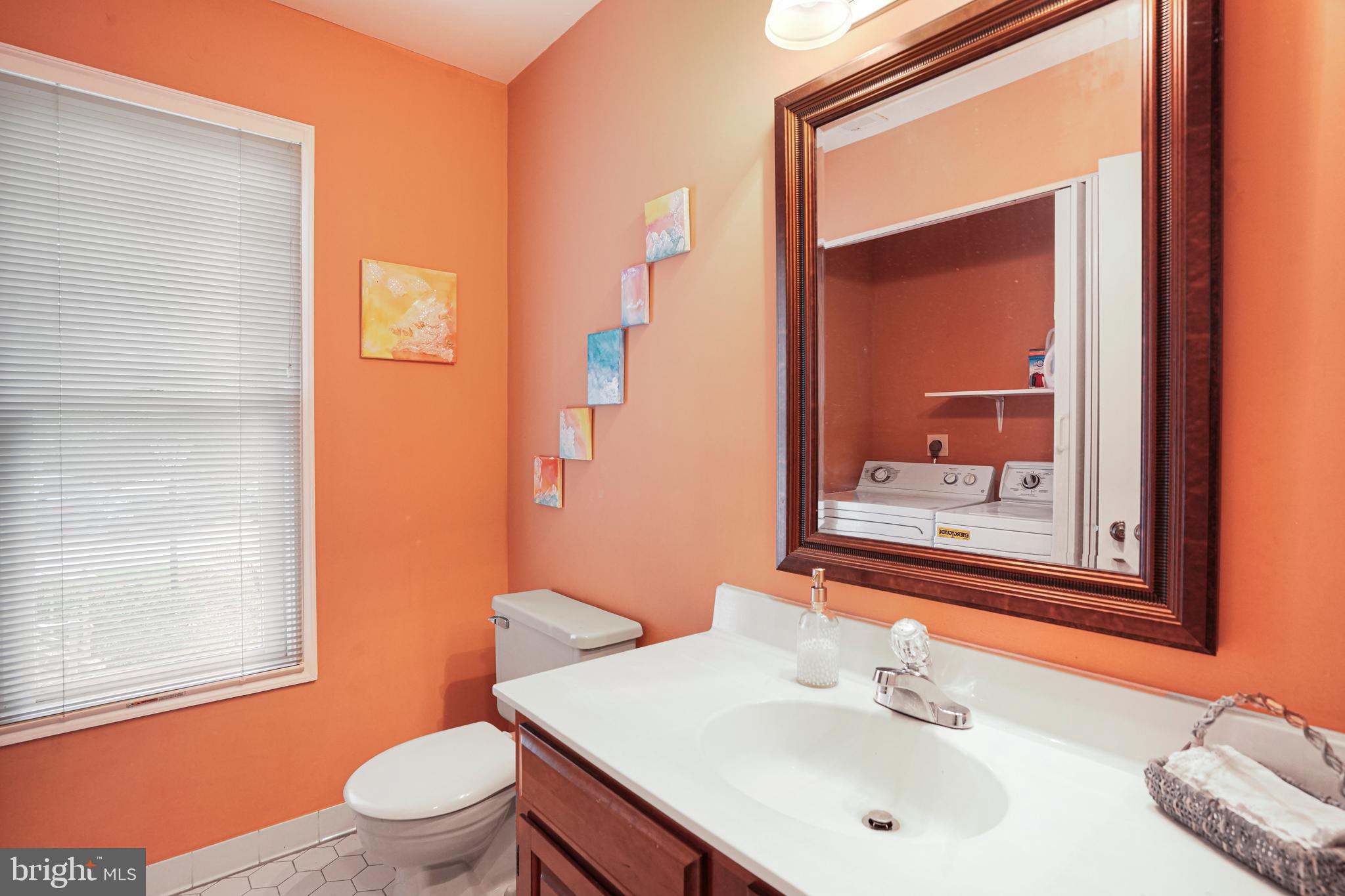 8872 Woodland Drive Silver Spring, MD 20910 - Photo 31 of 47 a bathroom with a sink a toilet and shower