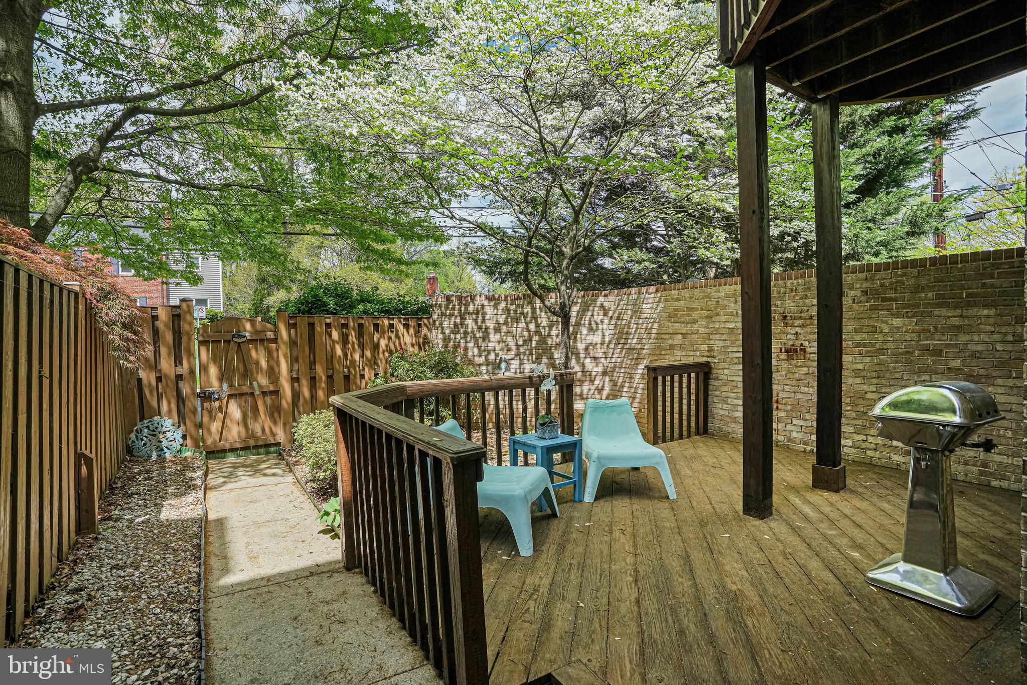 8872 Woodland Drive Silver Spring, MD 20910 - Photo 33 of 47 a view of deck with furniture and trees around