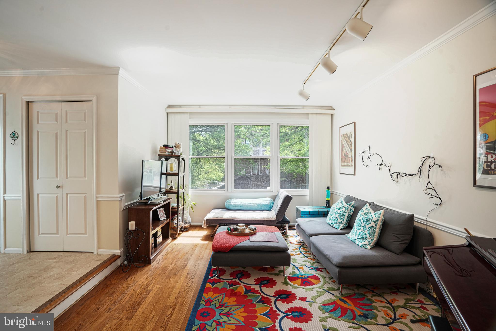 8872 Woodland Drive Silver Spring, MD 20910 - Photo 5 of 47 a bedroom with furniture and a window