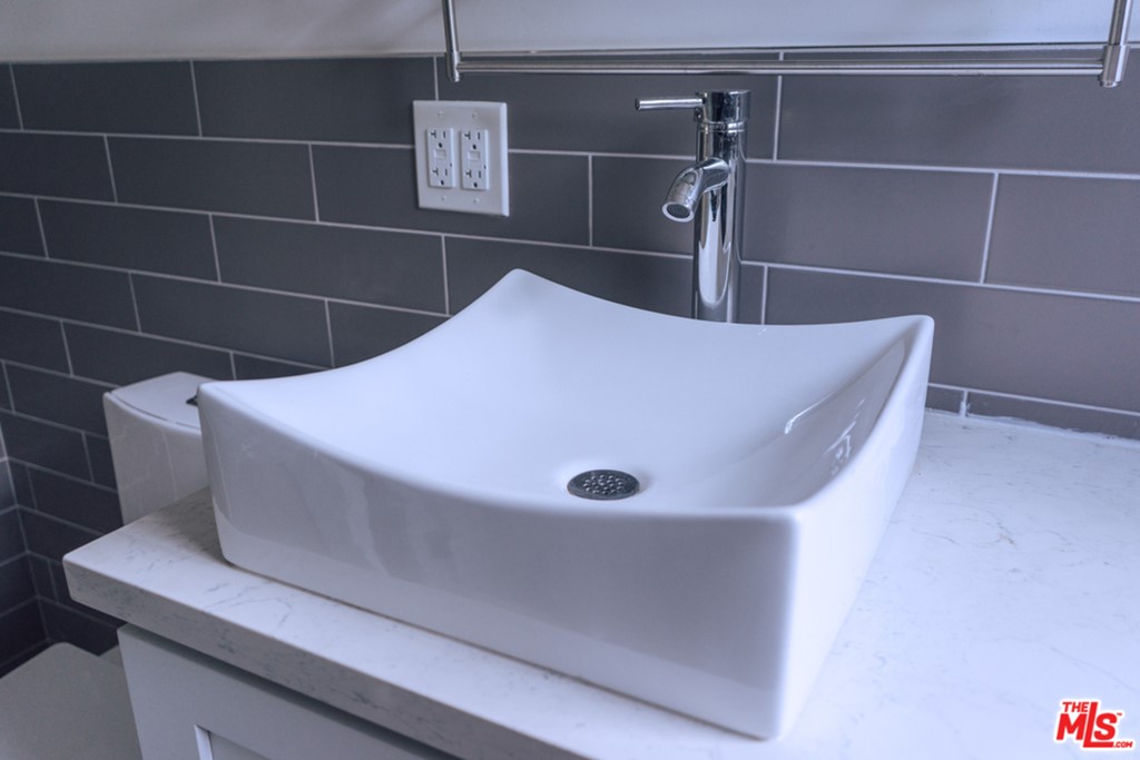 5478 Village Los Angeles, CA 90016 - Photo 17 of 31 a bathroom with a sink