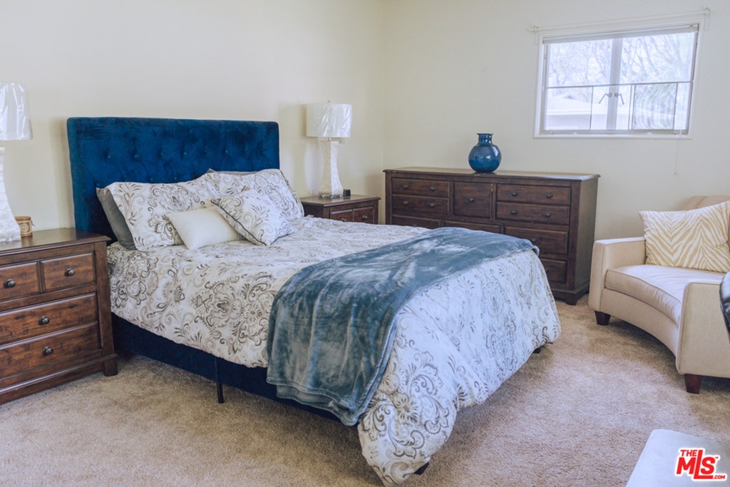 5478 Village Los Angeles, CA 90016 - Photo 20 of 31 a bedroom with bed and window