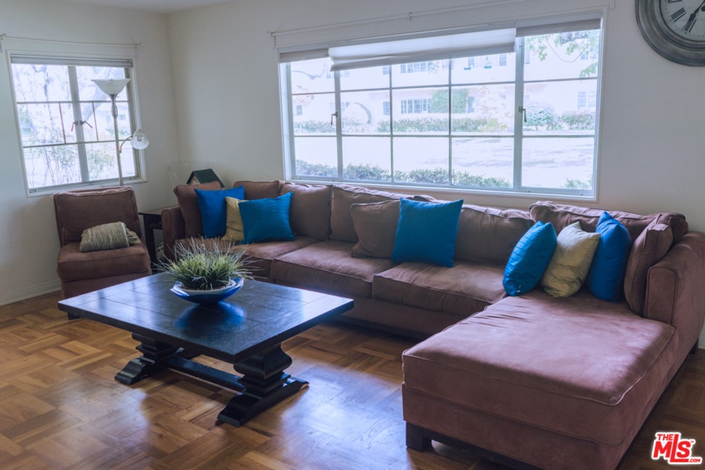 5478 Village Los Angeles, CA 90016 - Photo 4 of 31 a living room with furniture and a window