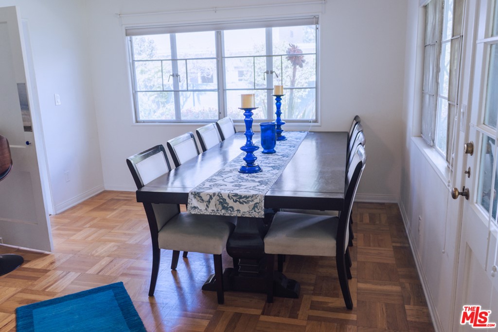 5478 Village Los Angeles, CA 90016 - Photo 8 of 31 a view of a dining room with furniture window and wooden floor