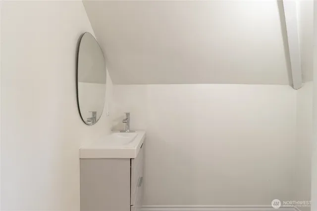 a bathroom with a sink and mirror