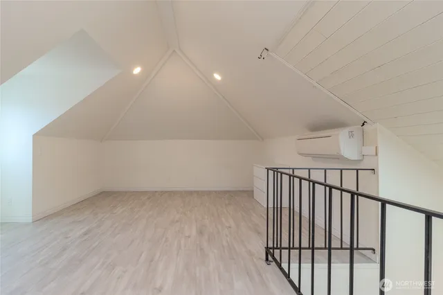 a view of hallway with wooden floor