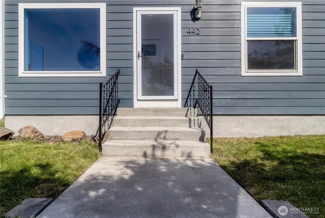 a view of a balcony with wooden floor