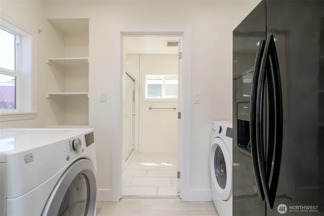 a view of a kitchen with washer and dryer