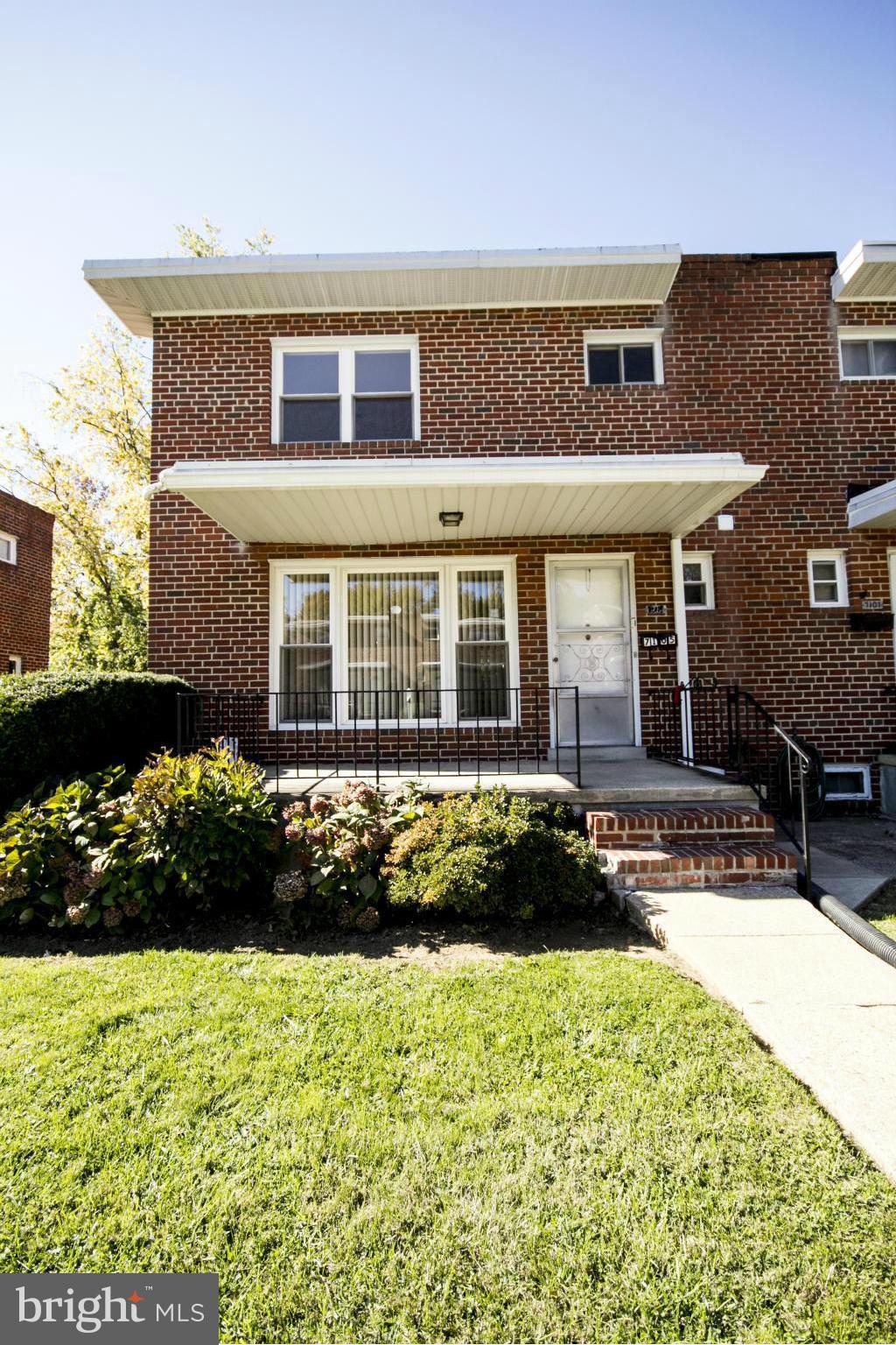 7105 Boxford Road Baltimore, MD 21215 - Photo 1 of 27 a front view of a house with a yard