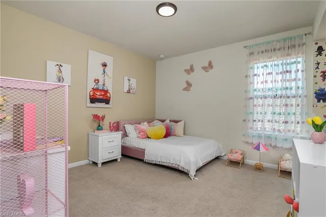 a bedroom with furniture and a window