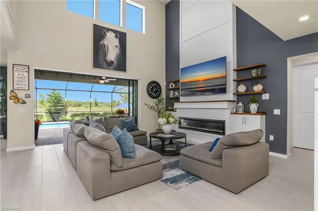 a living room with fireplace furniture and a flat screen tv